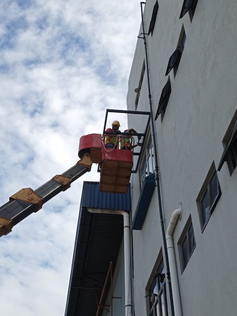 Why an Upper-Floor Awning Quote Needs More Than Width and Length Installer using a skylift for a third-floor metal deck balcony awning in Subang Jaya, Selangor.